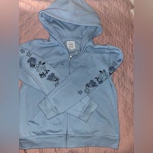 Sweater with embroidery on sleeves